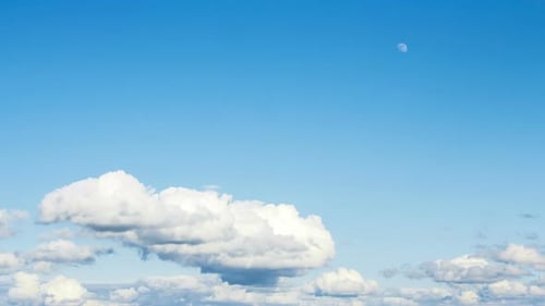 Fluffy Clouds Drifting Across Blue Sky Timelapse
