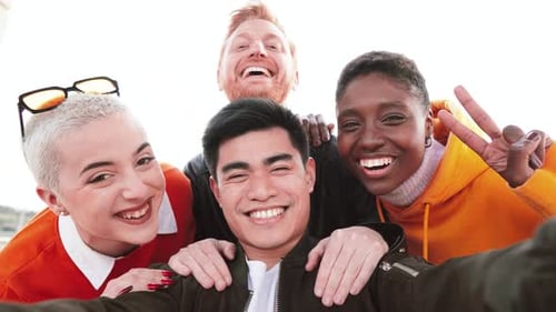 Group of Young Multiracial People Having Fun Smiling at Camera Outdoors