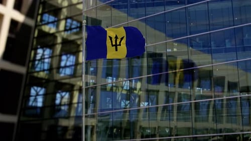 Barbados Flag Waving On A Skyscraper Building