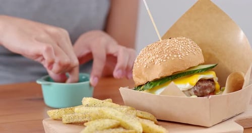 Dipping Fries with Gourmet Burger Close Up