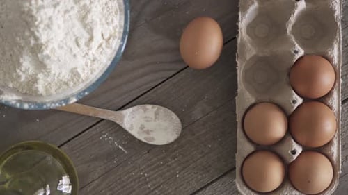 Baking Ingredients on Grey Wood Table Overhead Shot