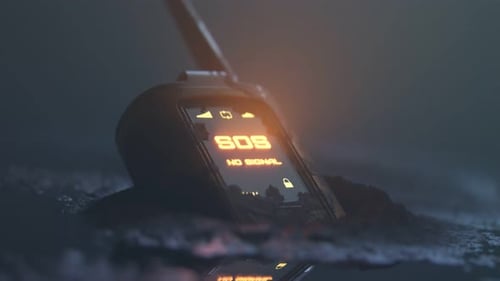 Close up of walkie-talkie left on the ground showing flashing SOS signal. 4K HD