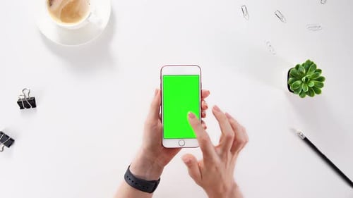 Hand Holding Smartphone with Green Screen and Chroma Key