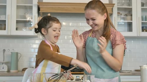 Little Girl and Mother Play with Flour Cooking Tasty Cake