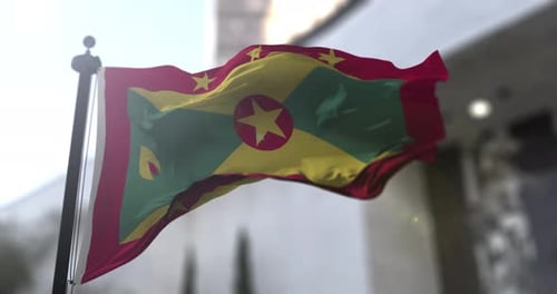 Realistic Grenada National Flag Waving in Wind Background