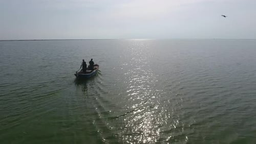 Boat Crossing Open Water on a Sunny Day