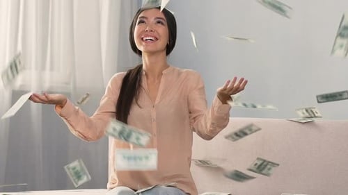 Woman Laughing as Money Falls Around Her