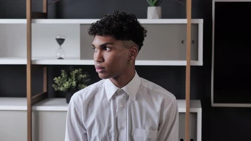 Young Adult with Piercings Poses Indoors
