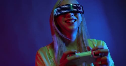 Young Asian woman playing metaverse virtual reality digital technology game with VR goggle.