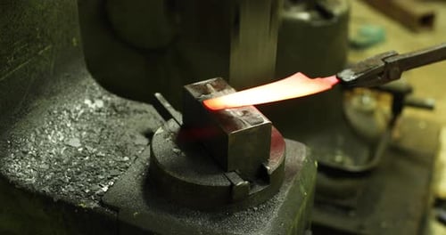 Metal Being Pressed by Machine