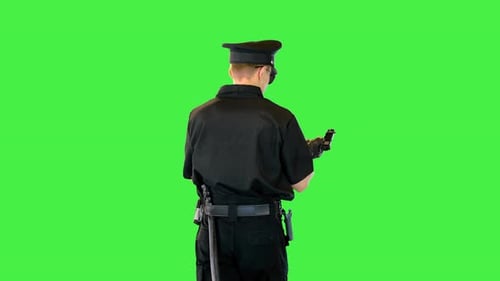 Caucasian Policeman Walks Gets the Gun Out Reloads and Puts It Back on a Green Screen Chroma Key