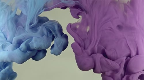 Blue and Purple Ink Swirling Together Abstractly