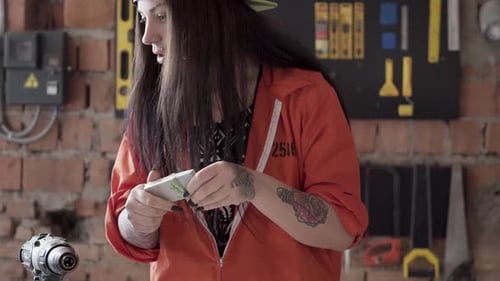 Young Adult Woman Working With Tools in Workshop