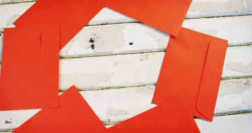 Red Envelopes on White Wood