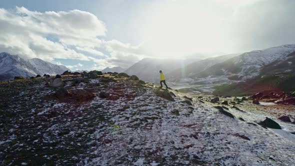 Cover for Man Standing On Rock Peak Snowy Winter Mountain Range Achievement Success Outstretched Arms Happines