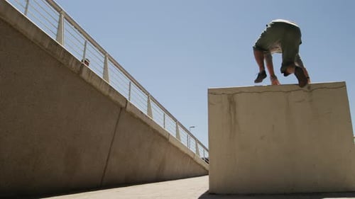 Men Practicing Parkour Outdoors in Urban Environment