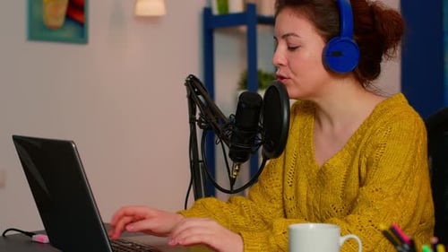 Vlogger Recording Podcast Using Mic at Home Studio