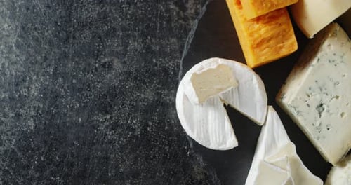 Collection of Cheese on a Black Surface