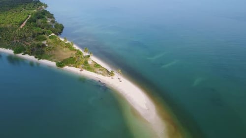 Sandy beach jutting out into the middle of the sea with beautiful water.