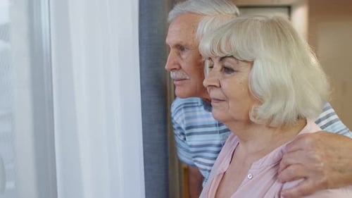 Senior Couple Looking out the Window