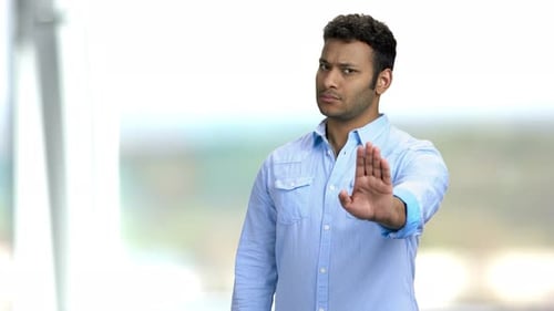 Young Adult with Stop Hand Gesture