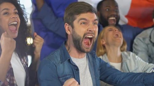 Excited Young Adults Cheer Victory Together