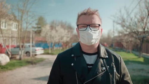 Adult Man Wearing Mask Standing Outside Daytime