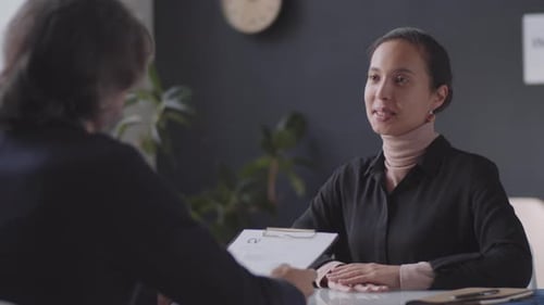 Adults at Interview in Modern Workplace