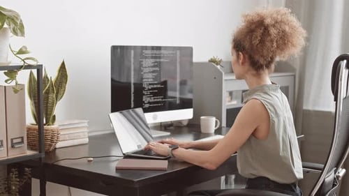 Female Programmer Working with Program Coding on Laptop