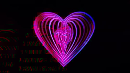Abstract Neon Heart Rotating on Black Background
