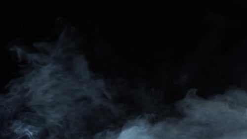 Grey Smoke Flowing on Black Background