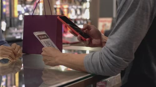 Asian Muslim Man Using Mobile Phone To Scan QR Code