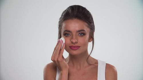 Beauty Makeup. Woman Using Powder Sponge For Make-Up