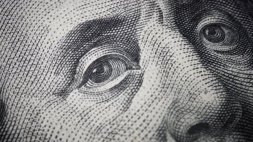 American one hundred dollar paper banknote in close up macro view dolly shot.