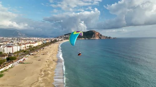 Aerial Drone View of Parachute Jumper Flying Over Beautiful Alanya
