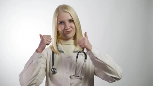 Blonde Doctor Gives Two Thumbs Up