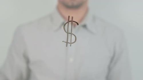 Signo de dólar escrito en la pantalla con la mano