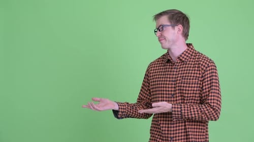 Man in Plaid Giving Thumbs Down Gesture