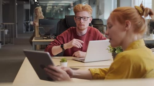 Young Adults Collaborating in Modern Office