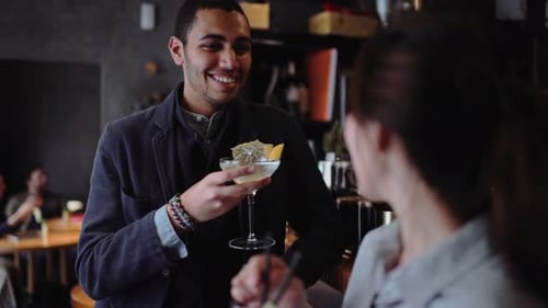 Friends having a drink at a bar