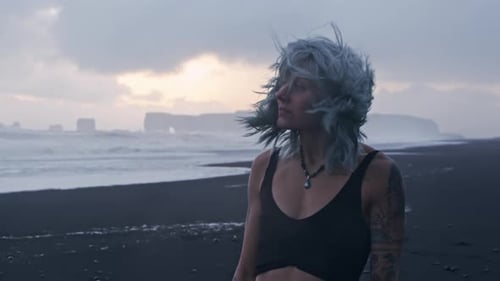 Cool Girl With Blue Hair On Black Beach