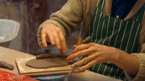 Adult Shaping Clay Indoors