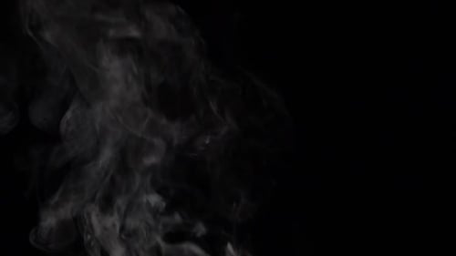 Wispy White Smoke Drifting on Black Background