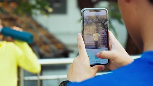 Person Editing Photo on Smartphone Screen