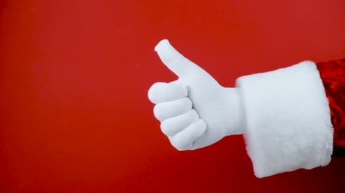 Santa Hand Gives Thumbs Up and Down