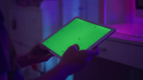 Closeup of Male Hands Holding Tablet with Green Screen