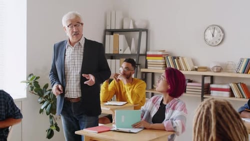Senior Professor Giving Lecture to Diverse College Students