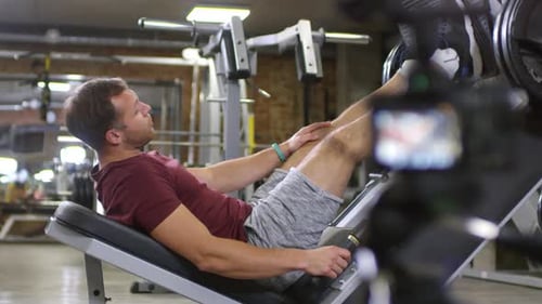 Man on Leg Press filmed with Camera