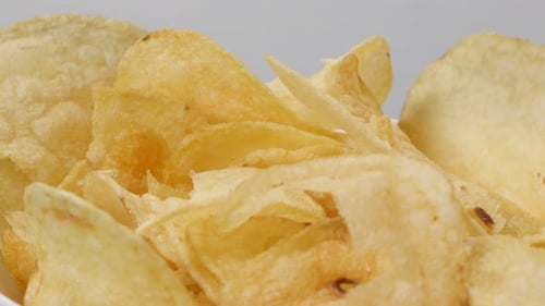 Golden Potato Chips in a Bowl Close-up