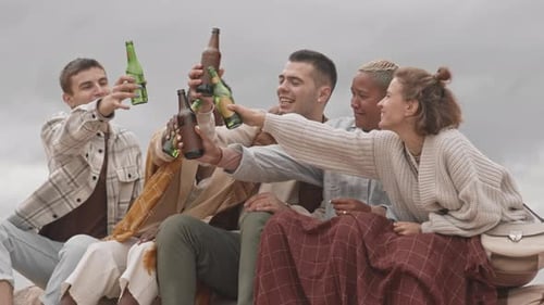 Friends Clinking Beer Bottles